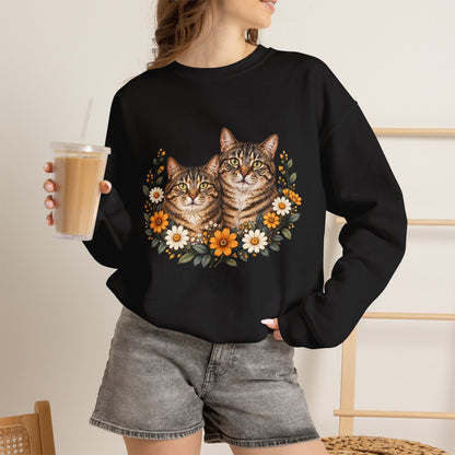 Black crewneck sweatshirt featuring two tabby cats surrounded by orange and white wildflowers
