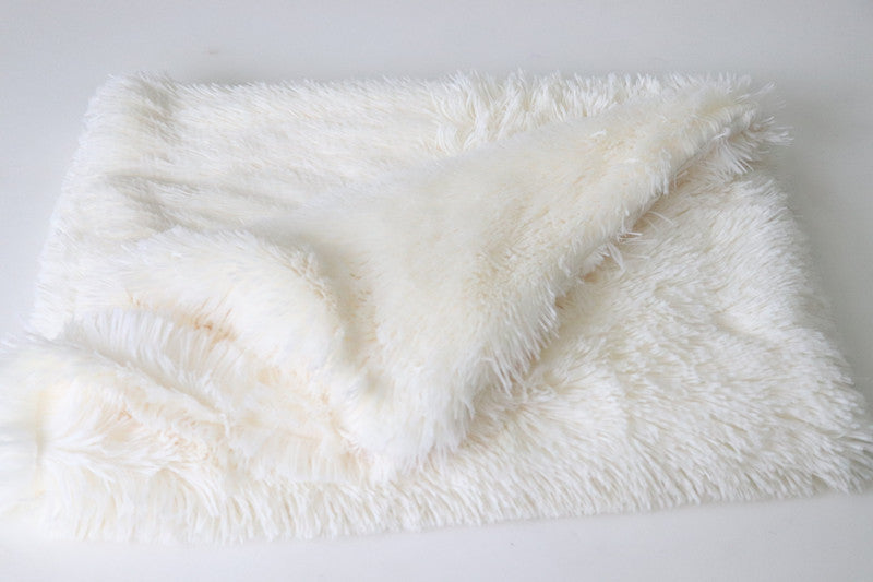 White fluffy blanket on a white background