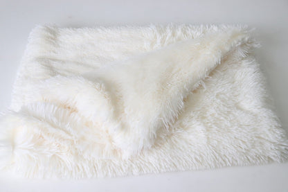 White fluffy blanket on a white background