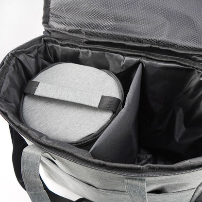 Gray bag with a cushion inside, possibly for travel or comfort.