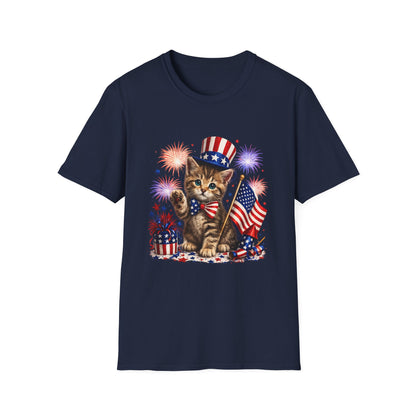 Navy blue t-shirt with a cat wearing an American flag hat and holding a flag, surrounded by fireworks on a white background.