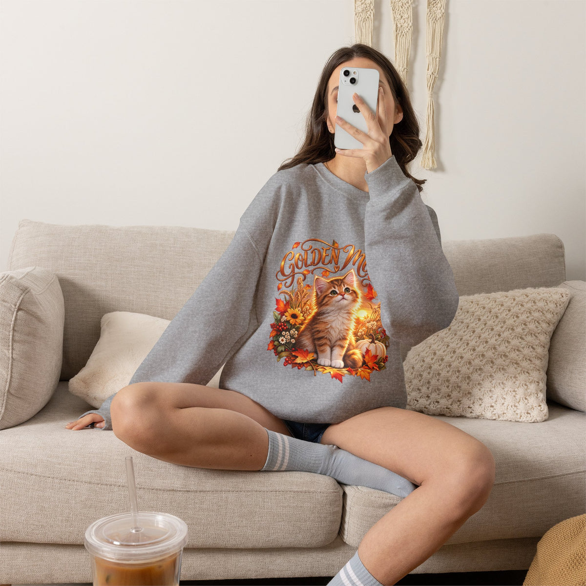 Close-up of Golden Moments orange-and-white kitten artwork printed on a fall crewneck sweatshirt
