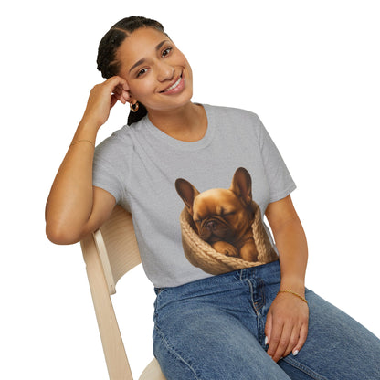 Person wearing a gray t-shirt with a dog graphic, sitting on a chair.