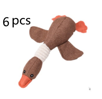 Plush toy resembling a duck with a bandage on a white background, labeled '6 pcs'.