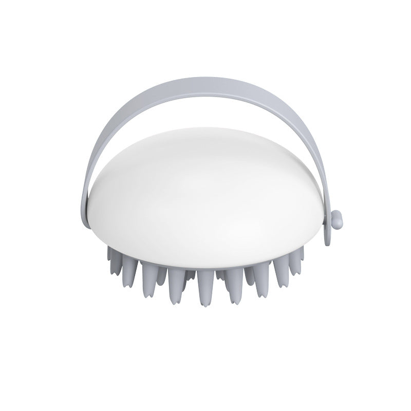 White scalp massager on a white background