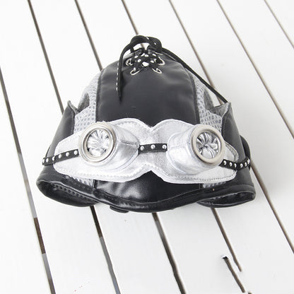 Black and white steampunk-style helmet on a wooden surface