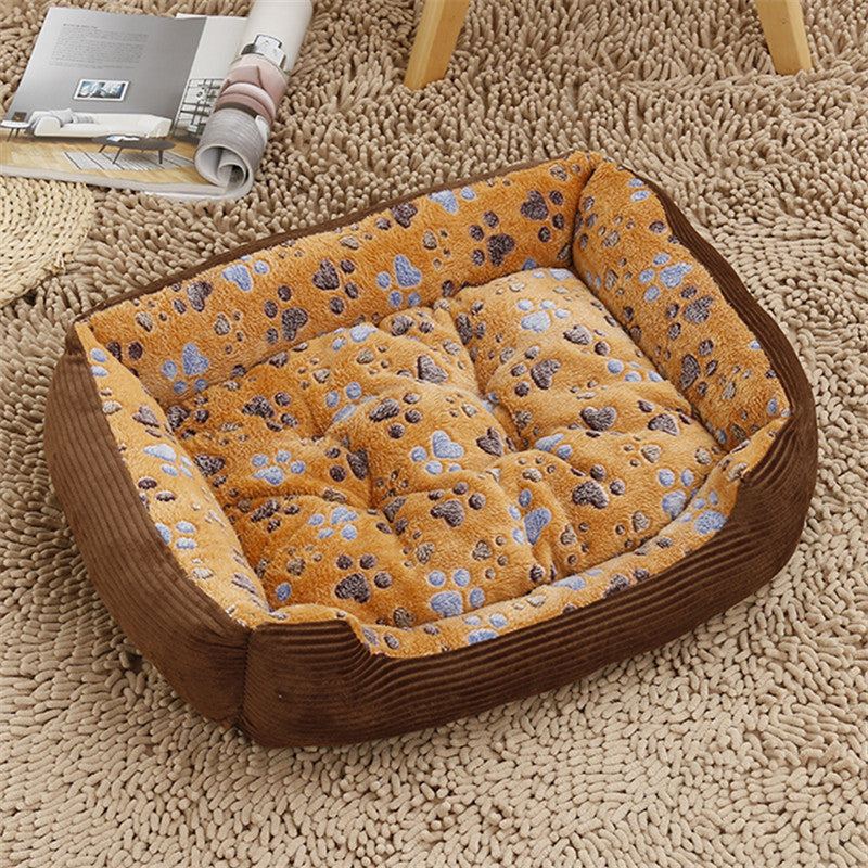 Pet bed with paw print pattern on a carpeted floor