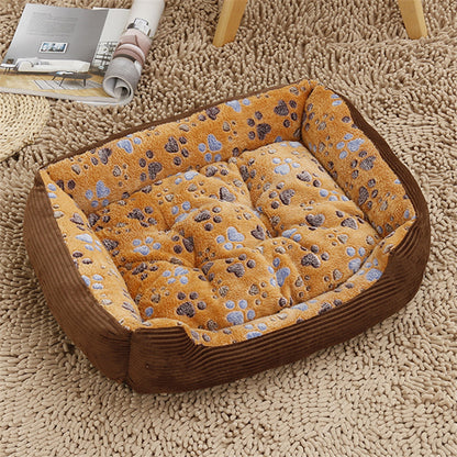 Pet bed with paw print pattern on a carpeted floor