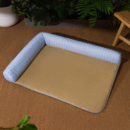 Pet bed with blue cushion on a brown floor