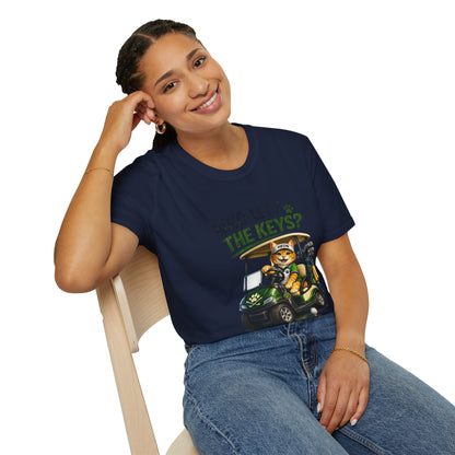 A woman wearing a navy blue graphic t-shirt with a cartoon cat in a golf cart and the text 'WHEN KEYS & THE KEYS?', sitting on a light wood chair against a white background.