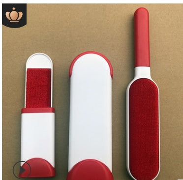 Three red and white cleaning brushes on a brown background