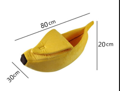 Yellow banana-shaped pet bed  with measurements on a white background