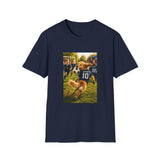 A black short-sleeve crewneck t-shirt featuring a rectangular graphic print on the front. The graphic depicts a golden retriever dog running in a soccer game, wearing a blue jersey with the number 10.