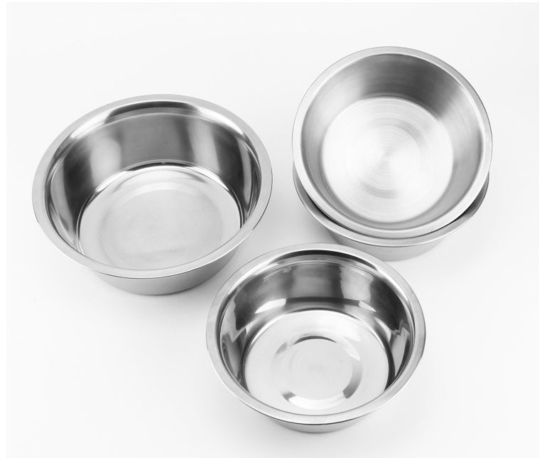 Three stainless steel bowls on a white background