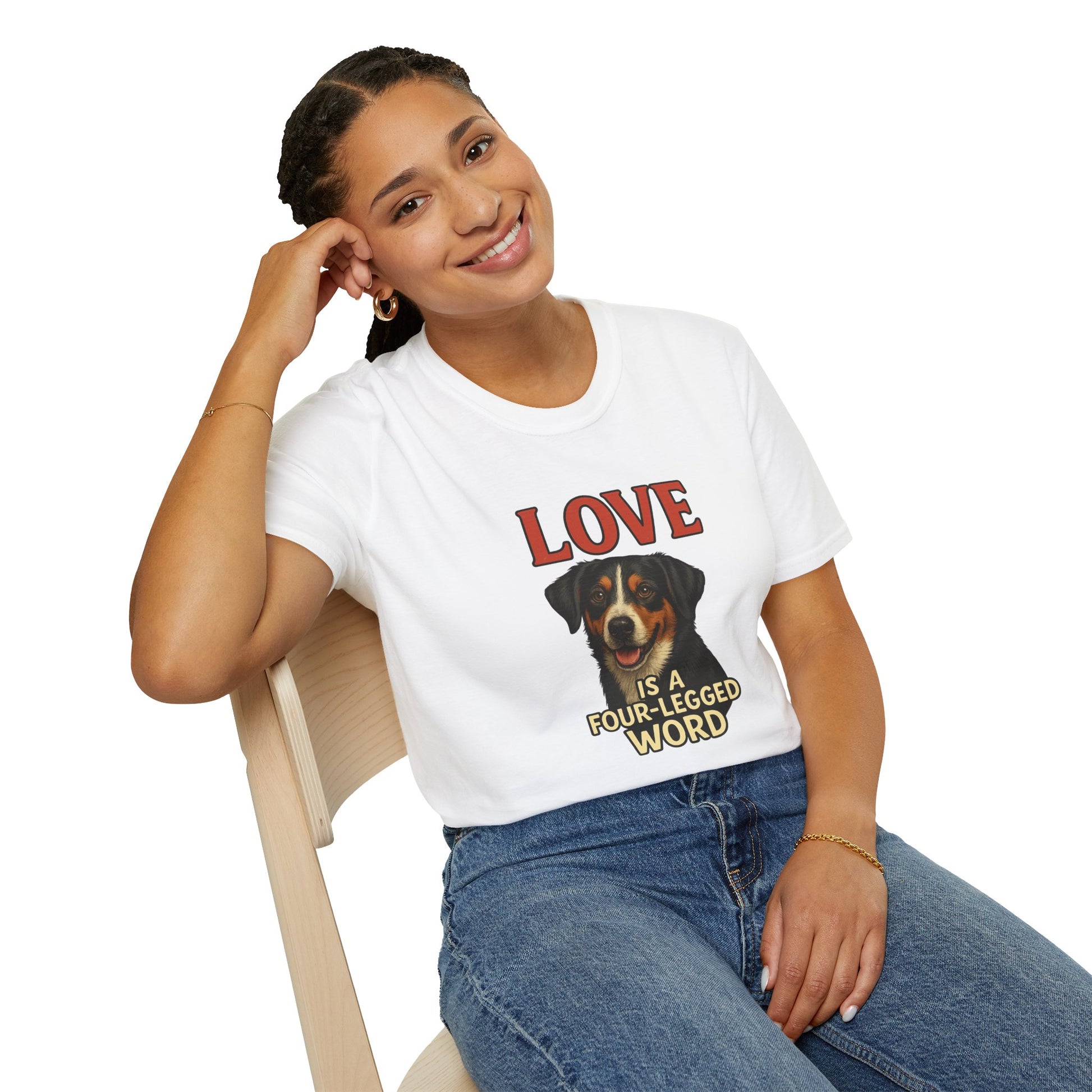 Person wearing a white t-shirt with a dog graphic and text, sitting on a chair.