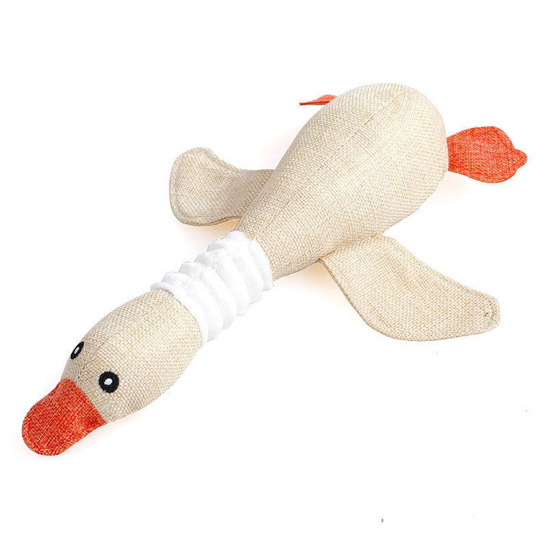 Textile duck toy with orange beak and feet on a white background