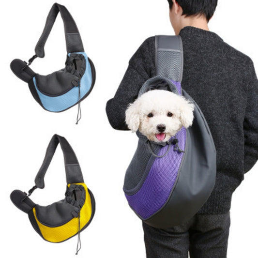 Person carrying a small dog in a pet carrier with three different color options displayed.