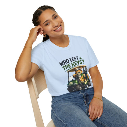 A woman sitting on a wooden chair wearing a light blue graphic t-shirt with the text 'WHO LEFT THE KEYS?' and a cartoon cat in a golf cart, paired with blue jeans against a white background.