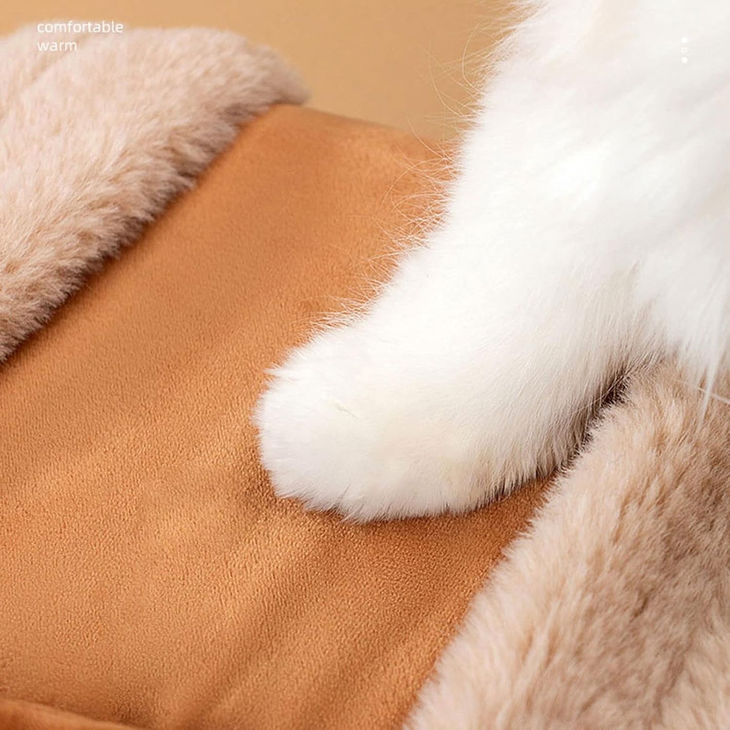 Close-up of brown fabric with white and beige fur accents