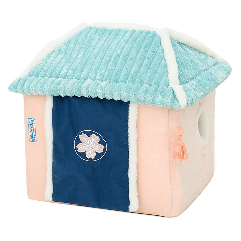 Pet house with a blue roof and pink body on a white background