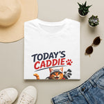 Anwhite short-sleeve crewneck t-shirt featuring a cartoon graphic of an orange tabby cat wearing a cap and holding golf clubs, with the text 'TODAY'S CADDIE' 