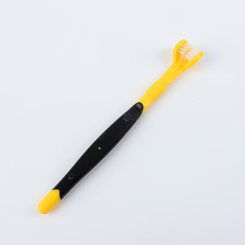 Yellow and black toothbrush on a white background
