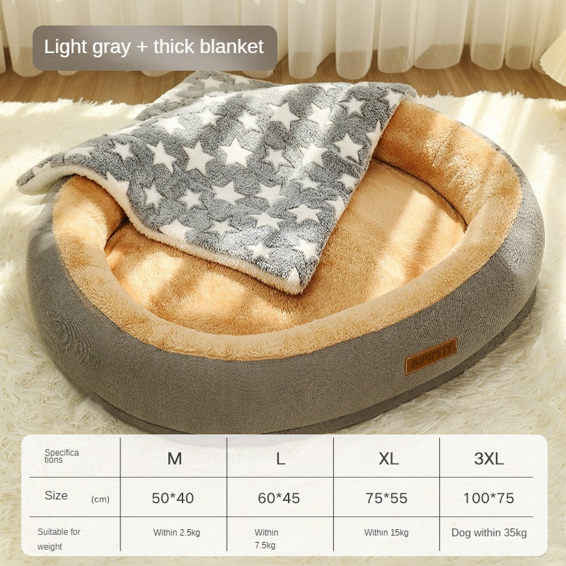 Dog bed with a light gray and thick blanket on a wooden floor.