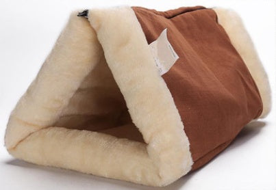 Triangular pet bed with brown and beige interior on a white background