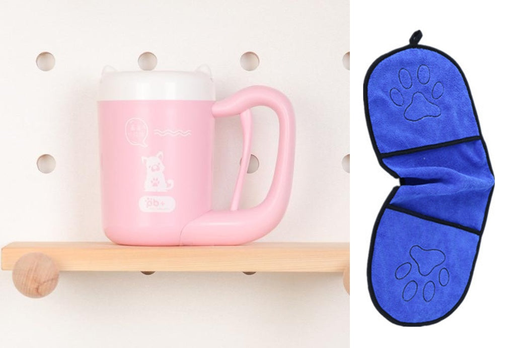 Pink mug on a wooden shelf with a blue paw print oven mitt next to it.
