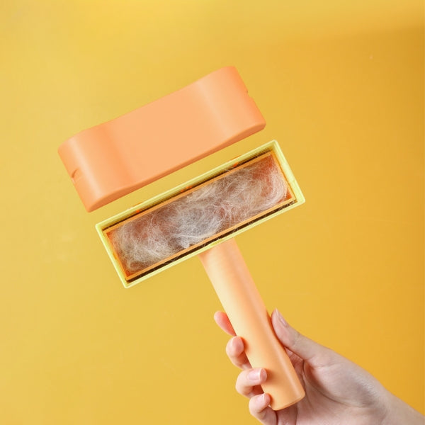 Hand holding a pet hair remover with collected hair against a yellow background
