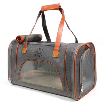 Gray pet carrier with orange accents on a white background