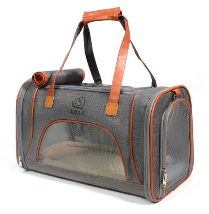 Gray pet carrier with orange accents on a white background