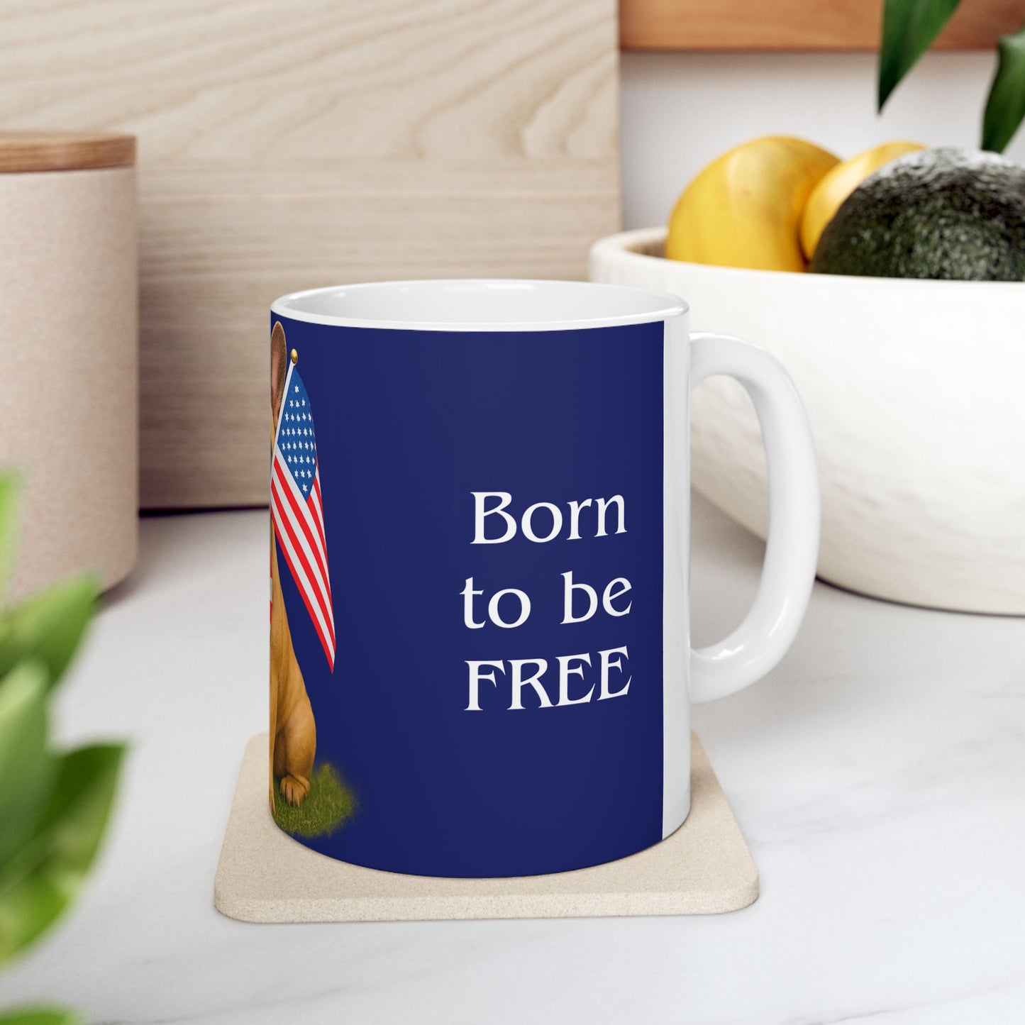 Mug with 'Born to be FREE' text and American flag on a coaster.