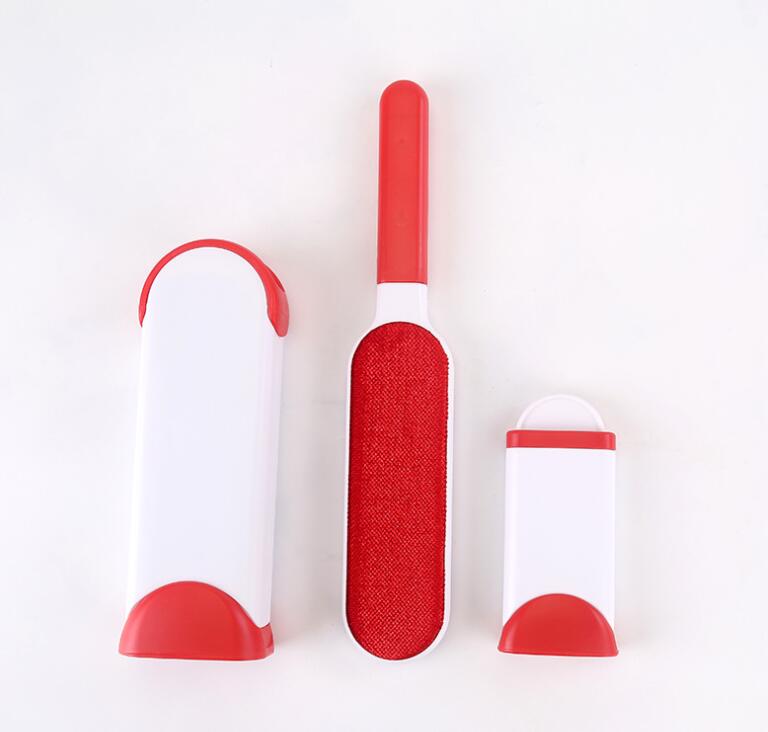 Red and white pet grooming brush set on a white background