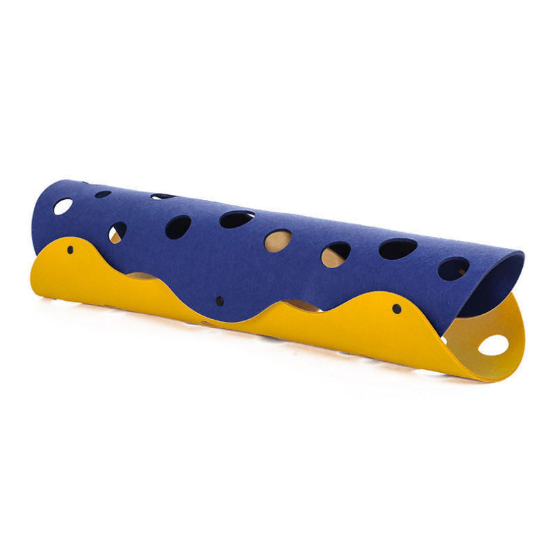 Blue and yellow plastic slide with multiple holes on a white background