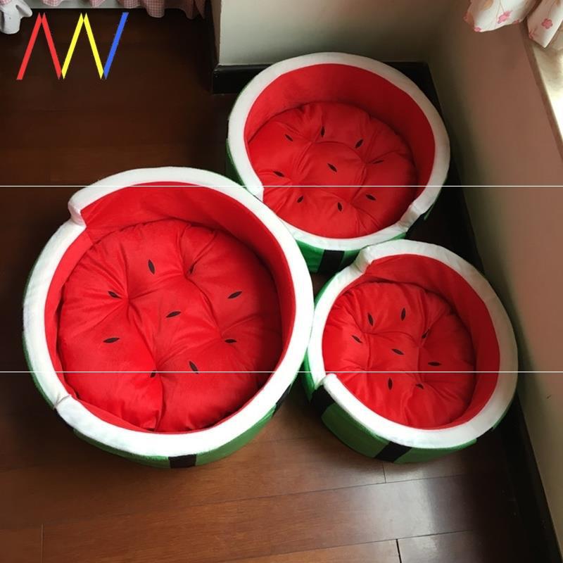 Watermelon-themed ottomans on a wooden floor