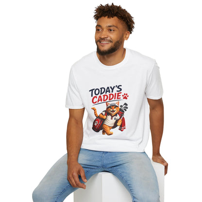 An white short-sleeve crewneck t-shirt featuring a cartoon graphic of an orange tabby cat wearing a cap and holding golf clubs, with the text 'TODAY'S CADDIE' 