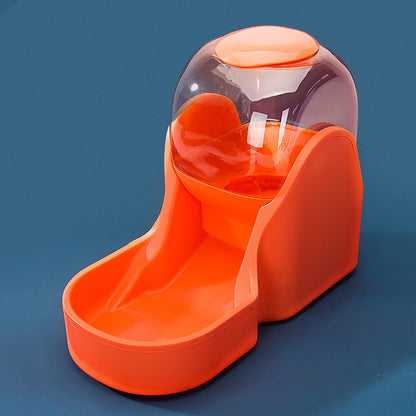 Orange pet feeder with transparent dome on a blue background