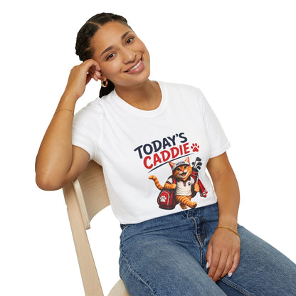 An white short-sleeve crewneck t-shirt featuring a cartoon graphic of an orange tabby cat wearing a cap and holding golf clubs, with the text 'TODAY'S CADDIE' 
