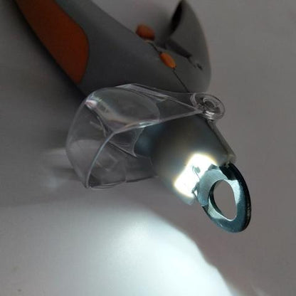 Close-up of a tool with a clear plastic component on a gray background