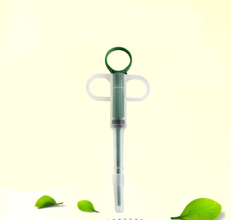 Green syringe-like tool with a white handle on a light green background