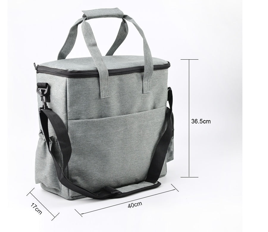 Gray cooler bag with black straps and measurements on a white background