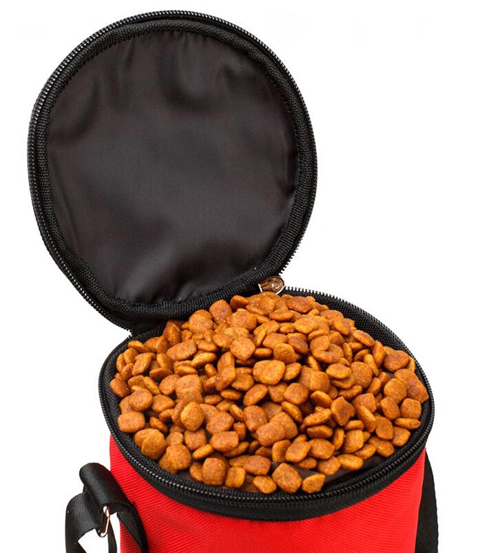 Red pet food container filled with dog food on a white background