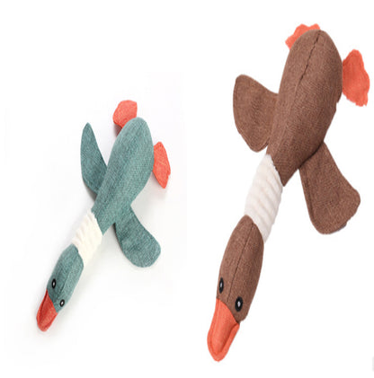 Two fabric duck toys on a white background