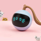 Round robot-like device with glowing eyes on a pink background
