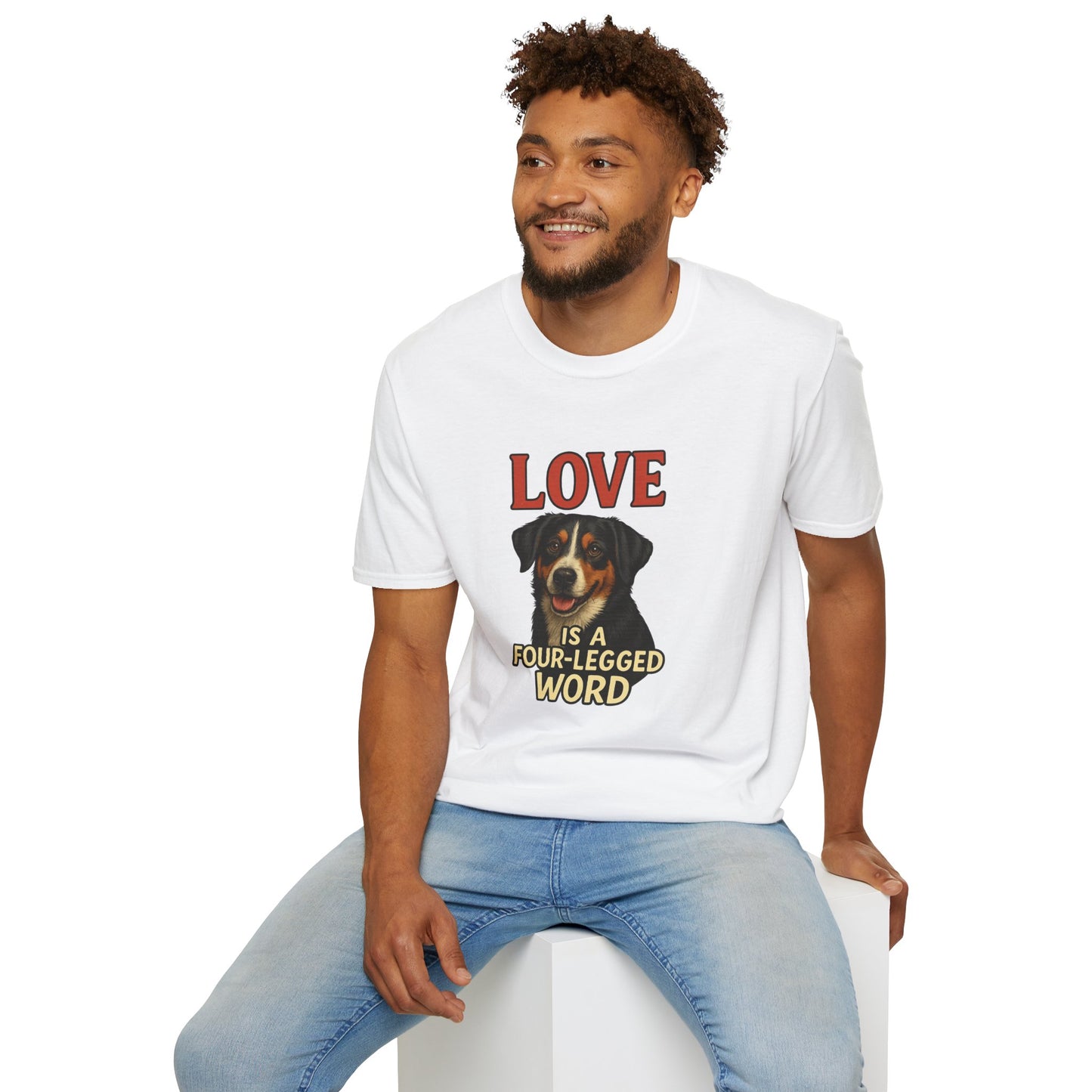 Man wearing a white t-shirt with a graphic design and text, sitting on a white stool against a white background.