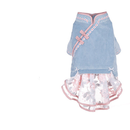 Light blue pet dress with pink accents and a floral skirt on a white background