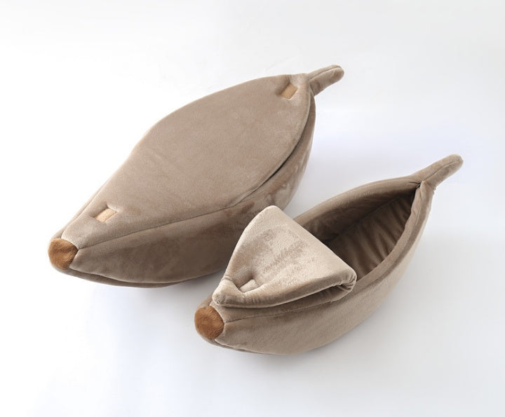 Pair of brown leaf-shaped pet beds on a white background
