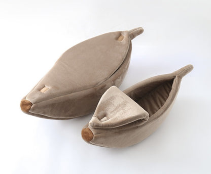 Pair of brown leaf-shaped pet beds on a white background