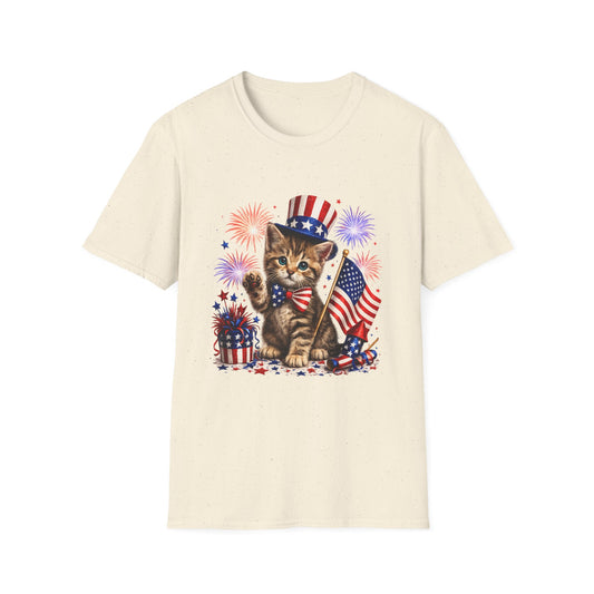 Cream t-shirt with a kitten holding an American flag and fireworks design on a white background